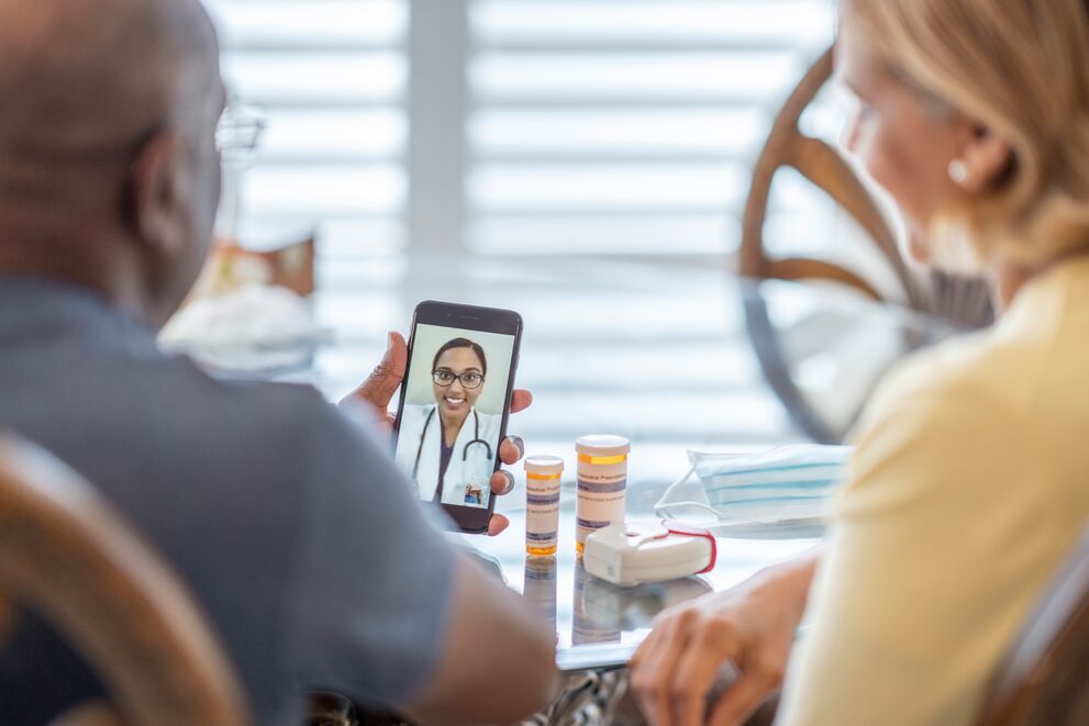 People attending telehealth appointment on smartphone
