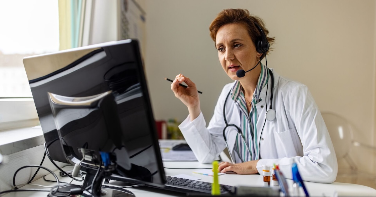 A doctor wearing a headset in a virtual consultation