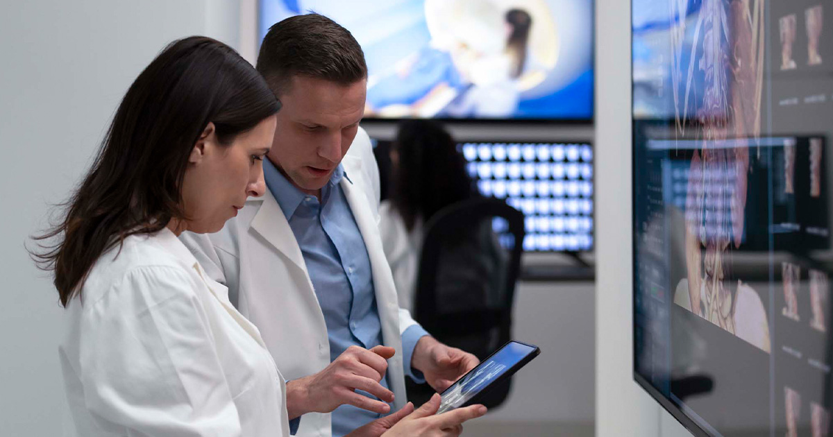 Healthcare workers looking at tablet