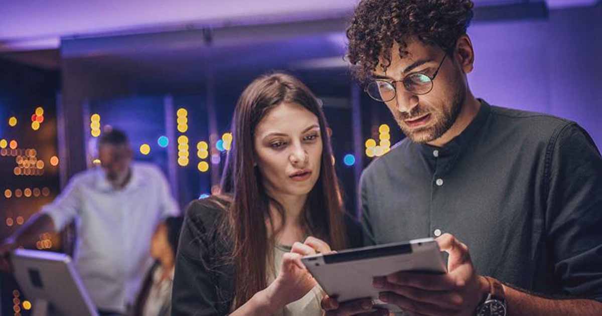 People looking at a tablet