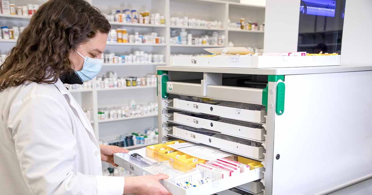 Pharmacist sorting medication