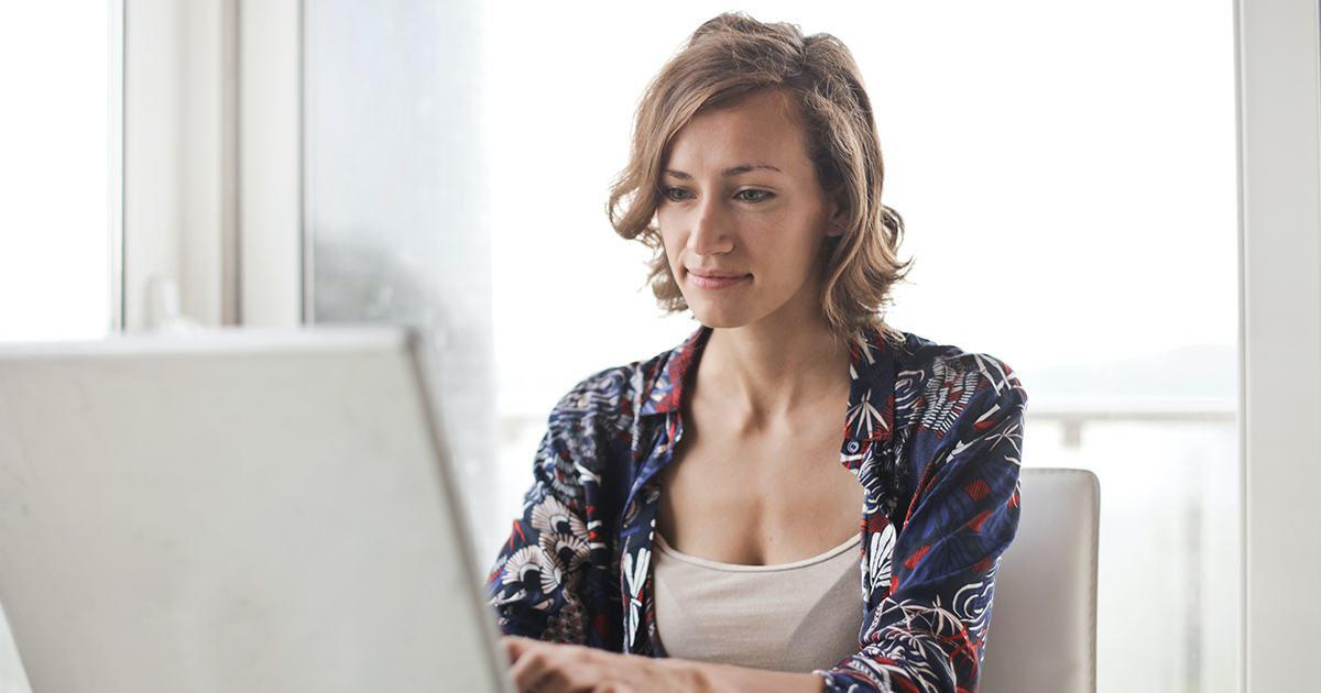 woman checks her patient portal from a laptop at home woman checks her patient portal from a laptop at home