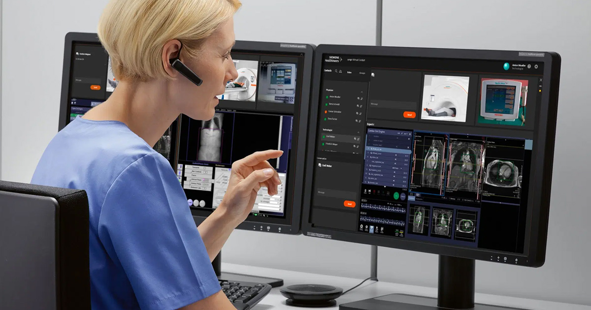 Healthcare worker with eapiece looking at medical images on a computer screen