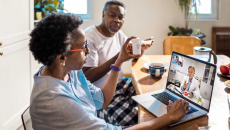 Patient at home on a televisit via laptop
