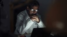 Physician working on laptop