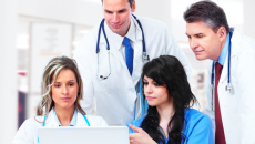doctors looking at computer