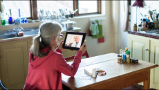 Person having telehealth visit via tablet
