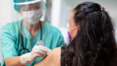 Nurse administers COVID-19 vaccine