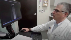 Health professional at desktop computer