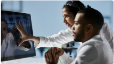 Healthcare workers looking at screen