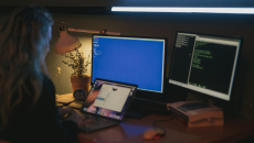 A person in front of computers