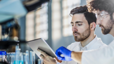 Scientists using a digital tablet