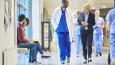 Healthcare workers walking in hallway