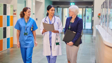 Healthcare workers talking in hallway