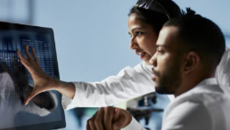 Healthcare workers looking at a monitor