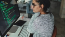 Person looking at code on a computer screen