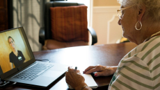 A person on a telehealth visit via laptop