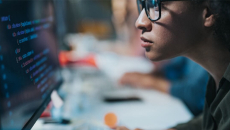 Person looking a code on a computer