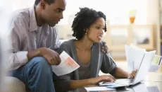 Couple looks at medical bills