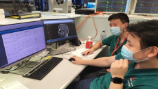 Healthcare staff looking at a computer.