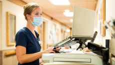 A nurse uses a computer