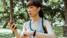 A person checking their vitals on a fitness tracker-paired smartphone