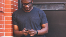 Man reading smartphone