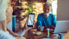 Two people consult with a doctor via telehealth