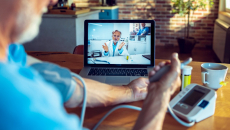 A patient communicating with health professional via videochat