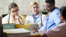Clinicians discussing with each other.