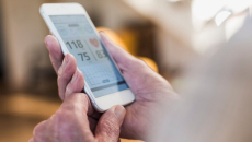 A person checking their health data in a mobile health app