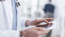 A doctor using a tablet