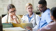 Health staff discussing among themselves