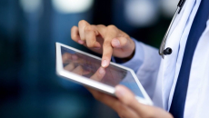 Health professional using a tablet