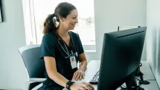 clinician using a desktop computer