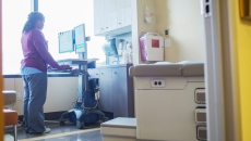 A nurse looking up a patient's record