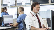 Healthcare workers using computers in an office