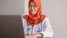 Doctor using laptop
