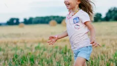 Child running in the field
