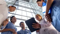 Medial team reviews patient data analytics on a tablet 