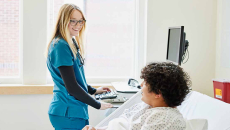 Healthcare worker talking to patient
