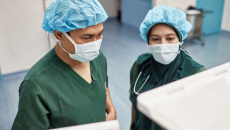 Surgeons assessing a scan