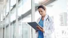 Healthcare worker looking at tablet