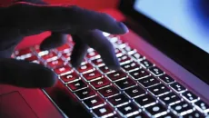 Hand typing prompts on keyboard