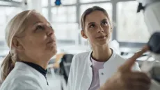 Clinicians monitoring a display