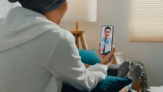 Patient attending telehealth appointment on smartphone