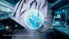 Doctor with tablet touching CGI healthcare symbol 