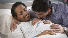 Parents holding a baby
