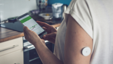 A diabetes patient tracking their blood glucose on a mobile app