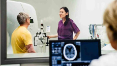 Healthcare workers conducting medical scan on patient